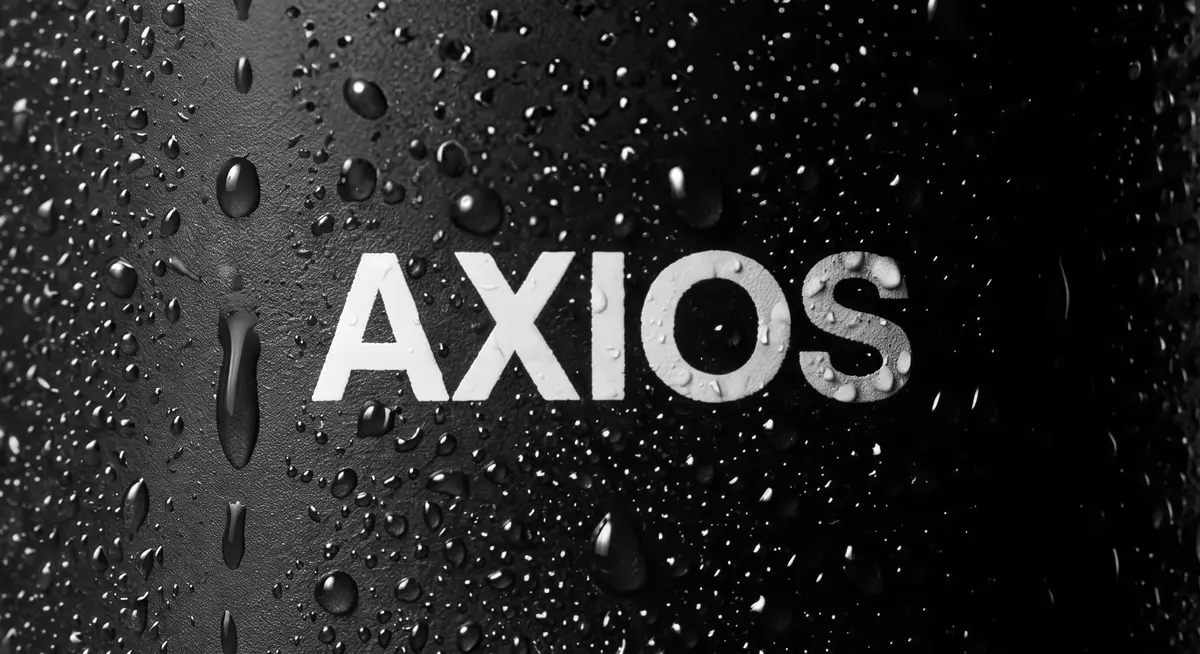 The Axios wordmark printed on black, beaded with water